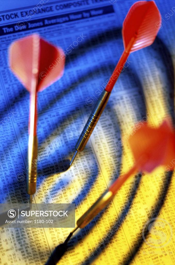 Stock Photo: 1180-102 High angle view of darts on a financial page