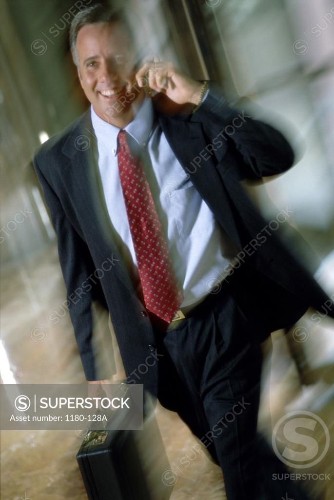 Stock Photo: 1180-128A Businessman talking on a mobile phone