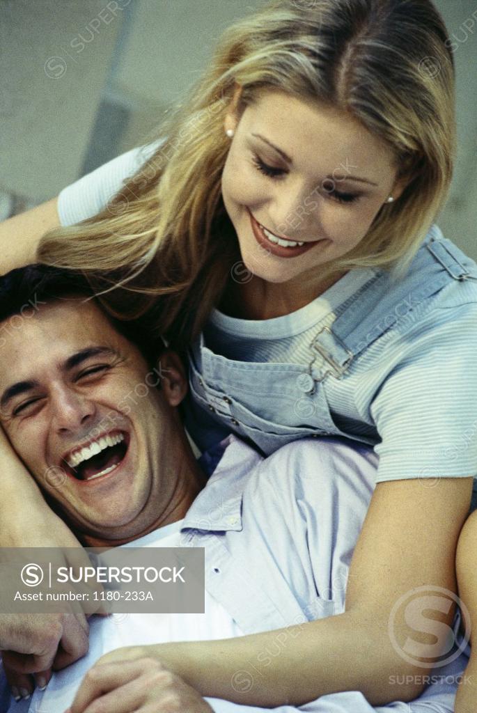 Stock Photo: 1180-233A Young couple holding hands laughing