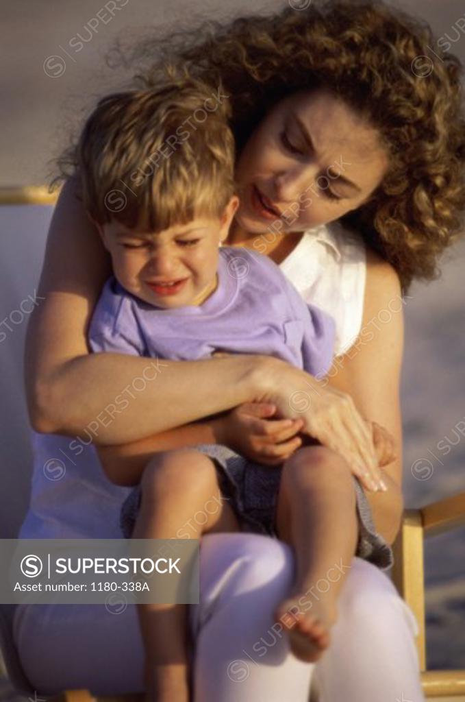 Stock Photo: 1180-338A Mother holding her son