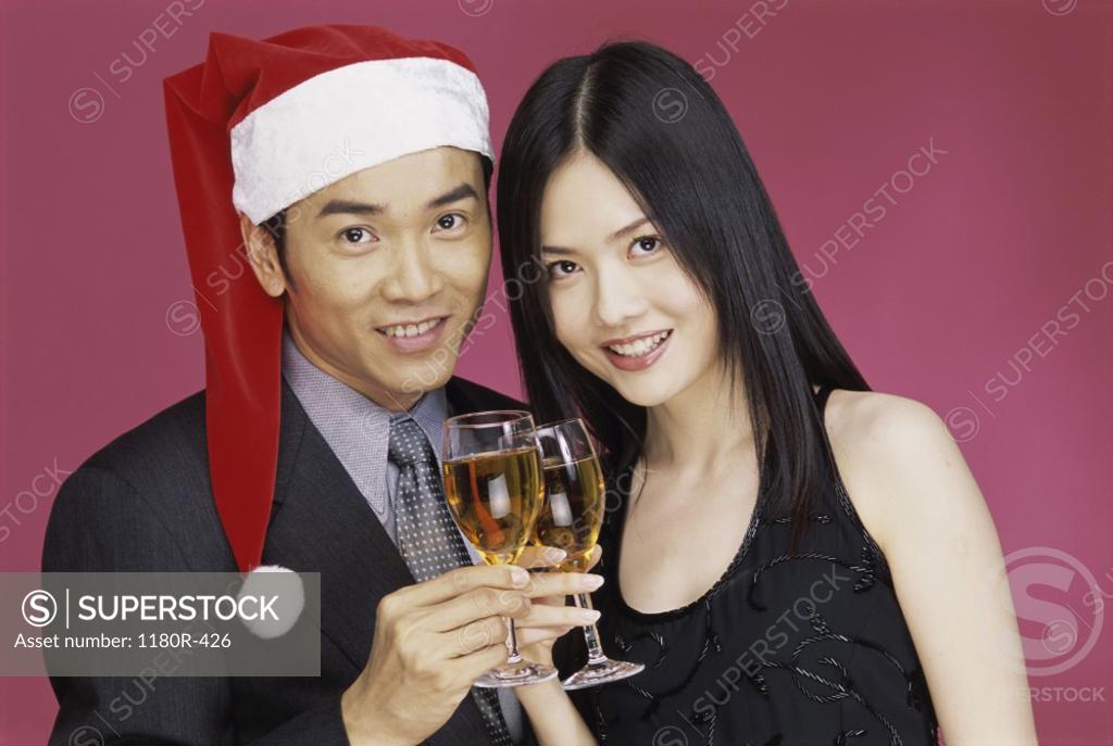 Stock Photo: 1180R-426 Portrait of a young couple holding wineglasses