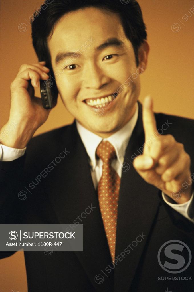 Stock Photo: 1180R-447 Portrait of a businessman talking on a mobile phone