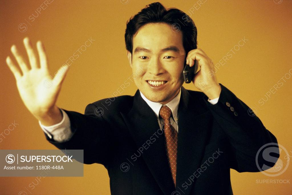 Stock Photo: 1180R-448A Portrait of a businessman talking on a mobile phone