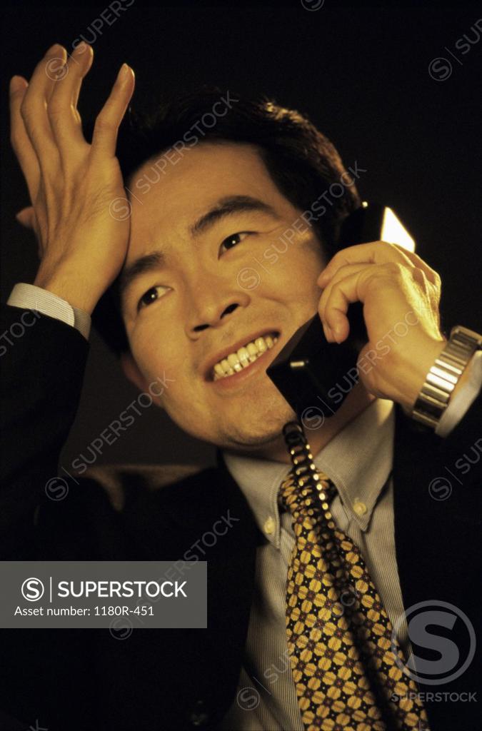Stock Photo: 1180R-451 Businessman talking on a mobile phone