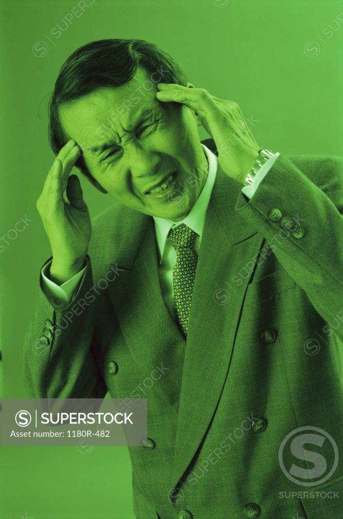 Stock Photo: 1180R-482 Man touching his head in pain