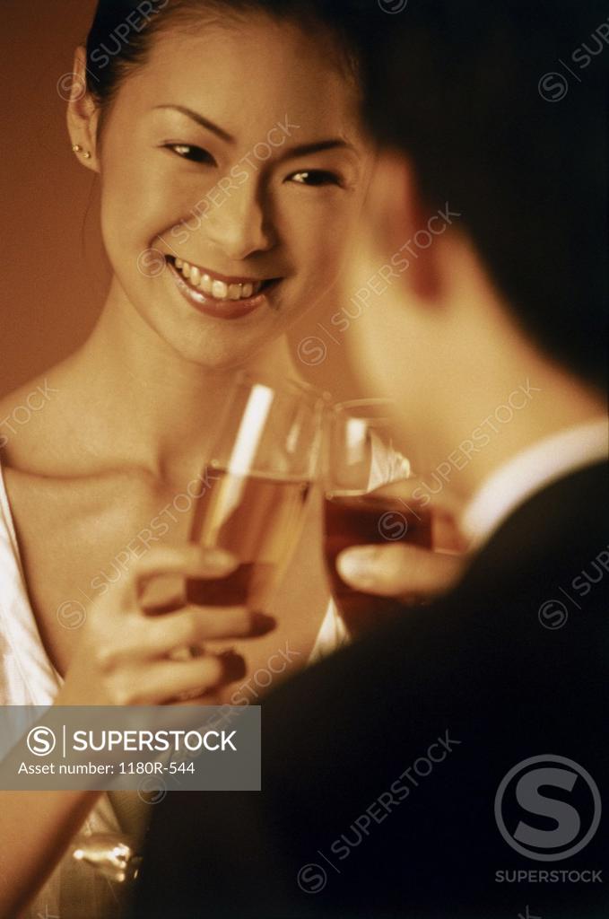 Stock Photo: 1180R-544 Close-up of a young couple toasting