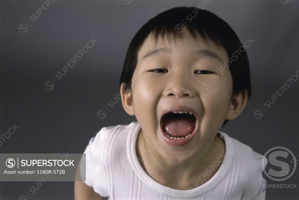 Stock Photo: 1180R-572B Portrait of a boy making a face