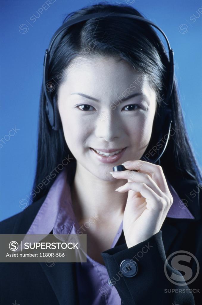 Stock Photo: 1180R-586 Portrait of a customer service representative wearing a headset smiling