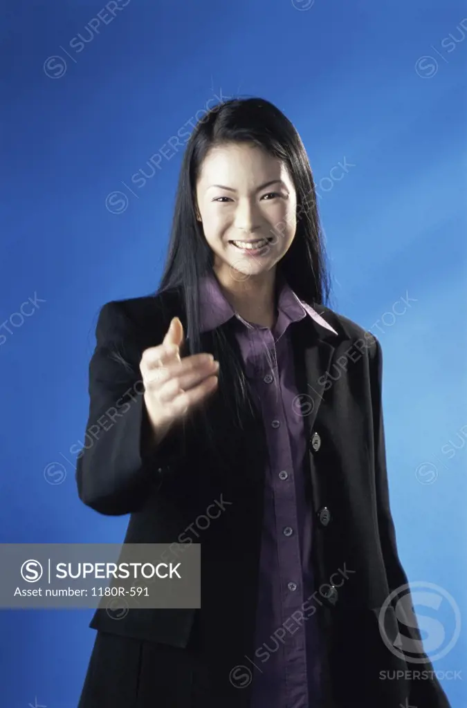 Portrait of a businesswoman pointing