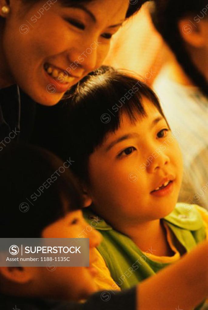 Stock Photo: 1188-1135C Close-up of a teacher with her two students