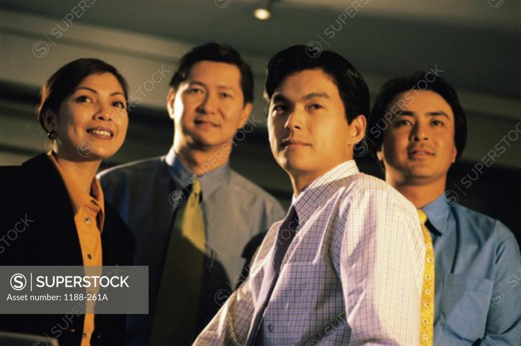 Stock Photo: 1188-261A Three businessmen and a businesswoman in an office