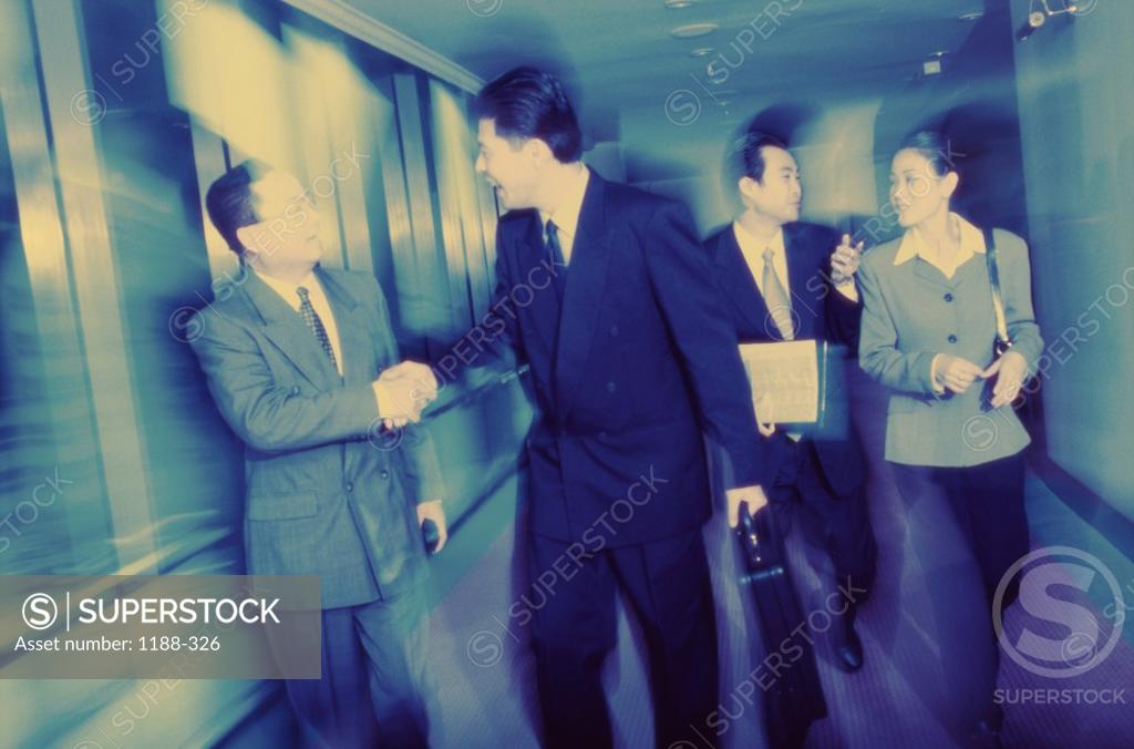 Stock Photo: 1188-326 Business executives walking together