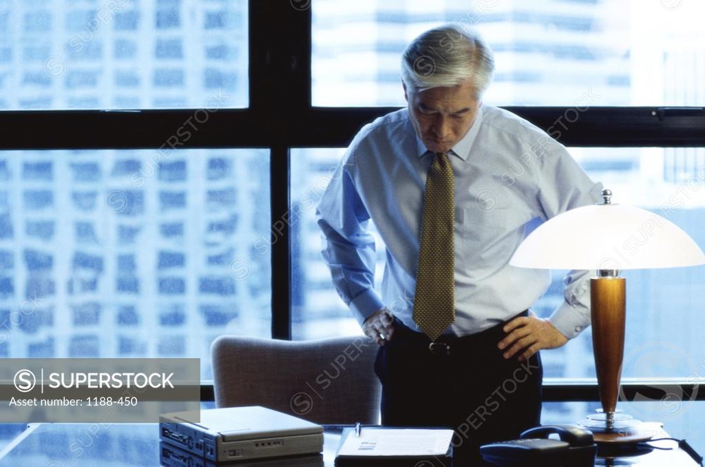 Stock Photo: 1188-450 Businessman standing in an office