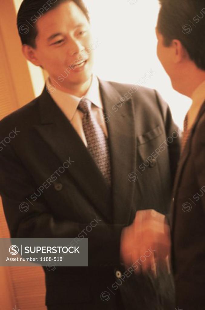 Stock Photo: 1188-518 Two businessmen shaking hands