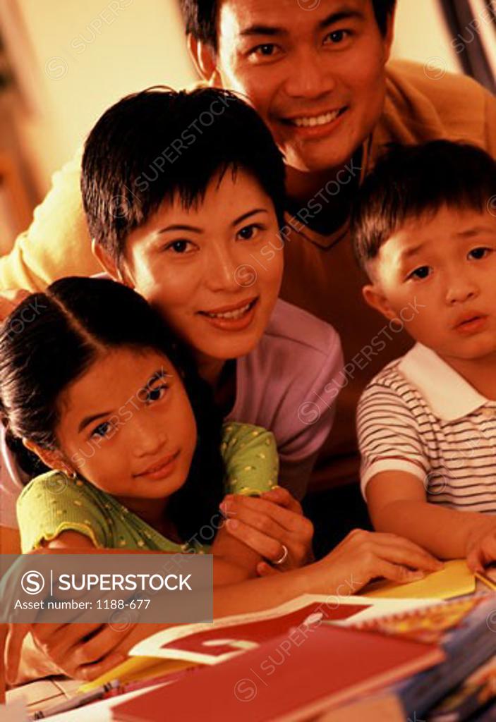 Stock Photo: 1188-677 Portrait of a mid adult couple with their son and daughter