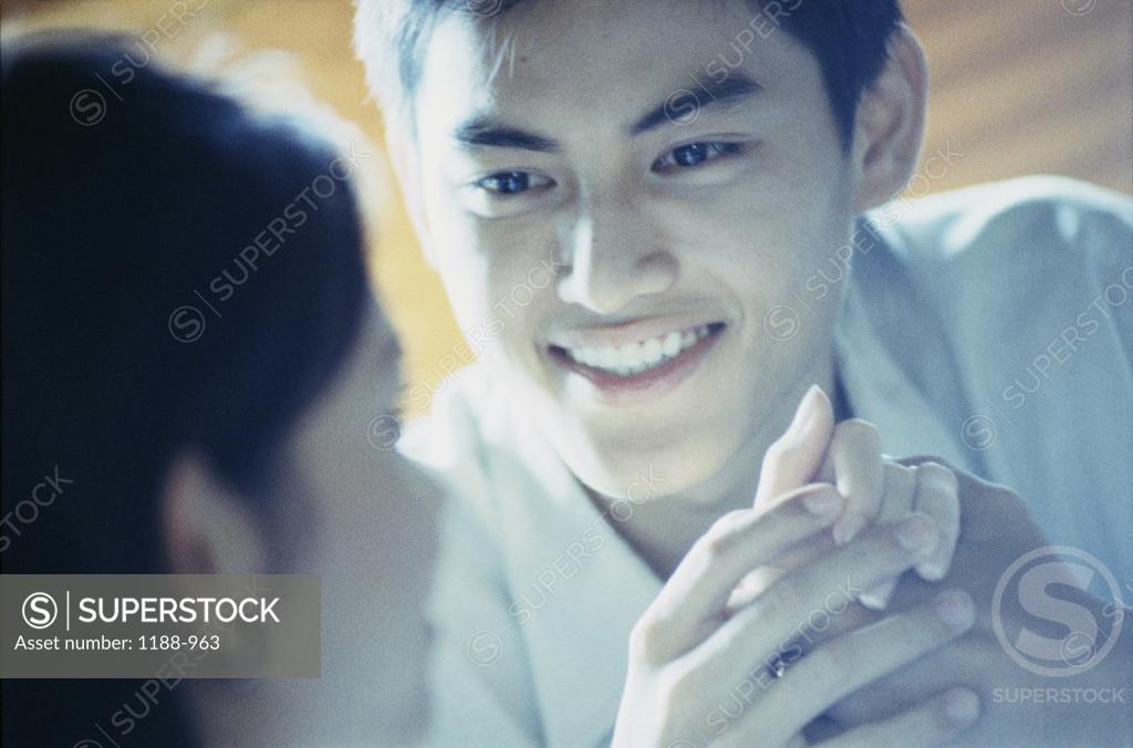 Stock Photo: 1188-963 Young couple looking at each other