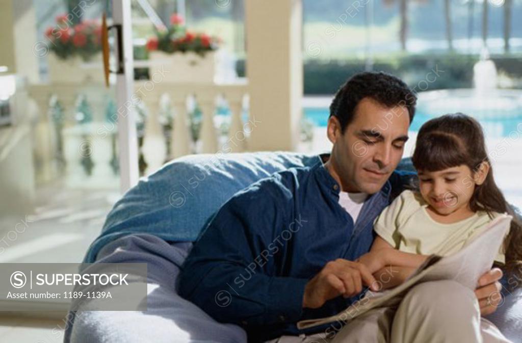 Stock Photo: 1189-1139A Father teaching his daughter