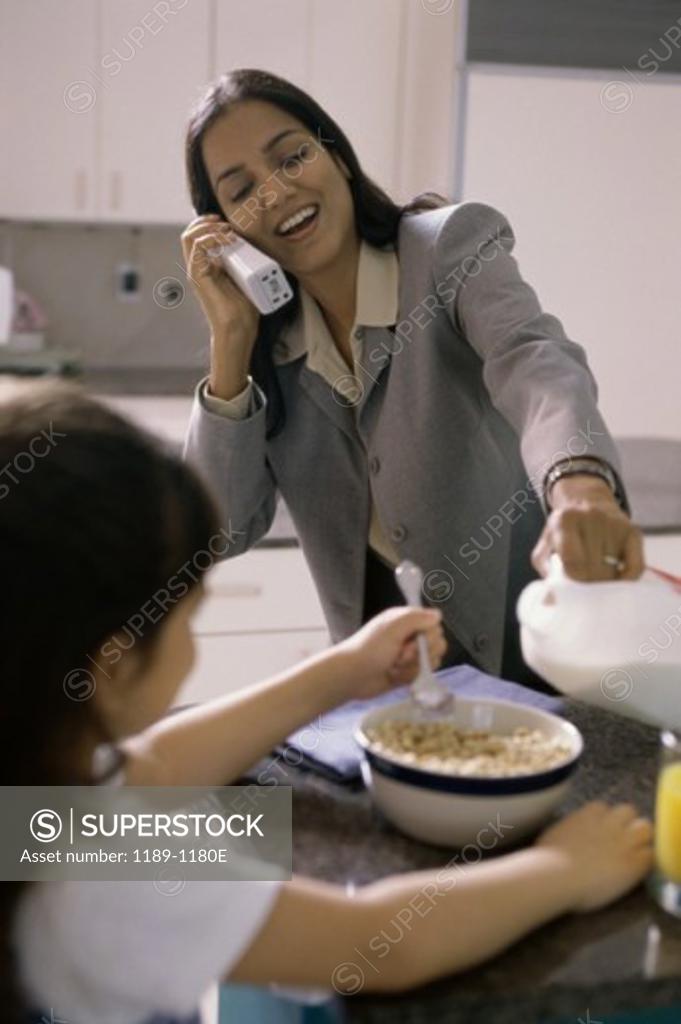 Stock Photo: 1189-1180E Mother and her daughter in the kitchen