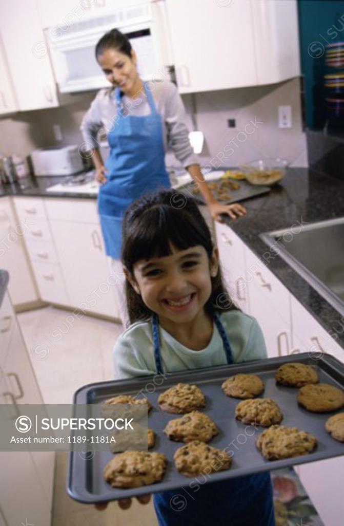 Stock Photo: 1189-1181A Mother and her daughter baking