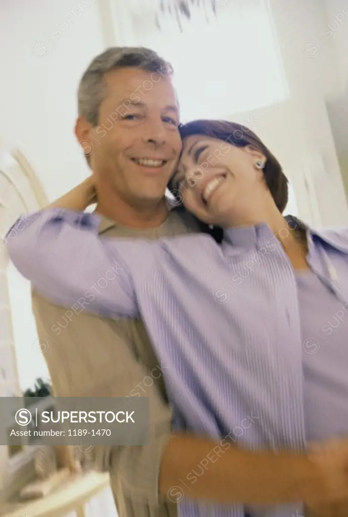 Portrait of a mid adult couple hugging