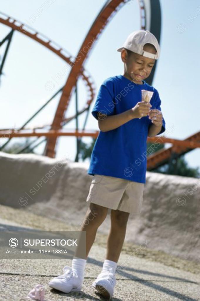 Stock Photo: 1189-1882A Boy crying after dropping ice cream