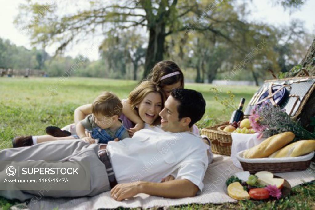 Stock Photo: 1189-1947A Parents with their son and daughter at a picnic