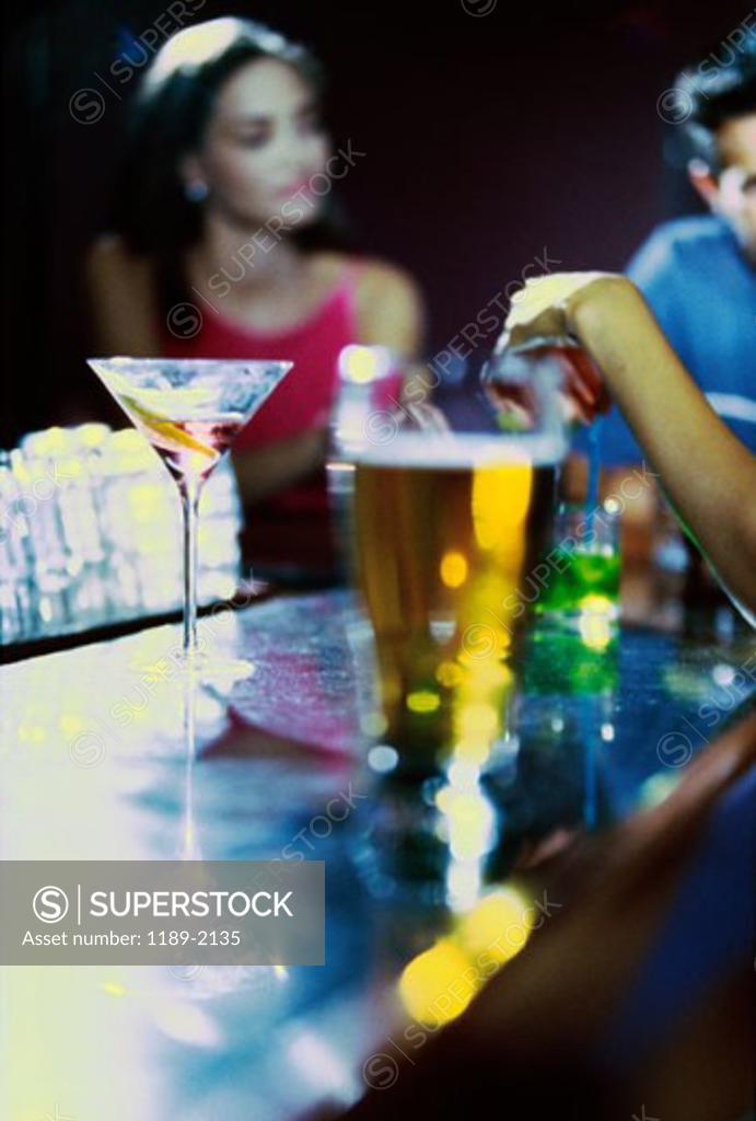 Stock Photo: 1189-2135 Young woman drinking wine in a bar