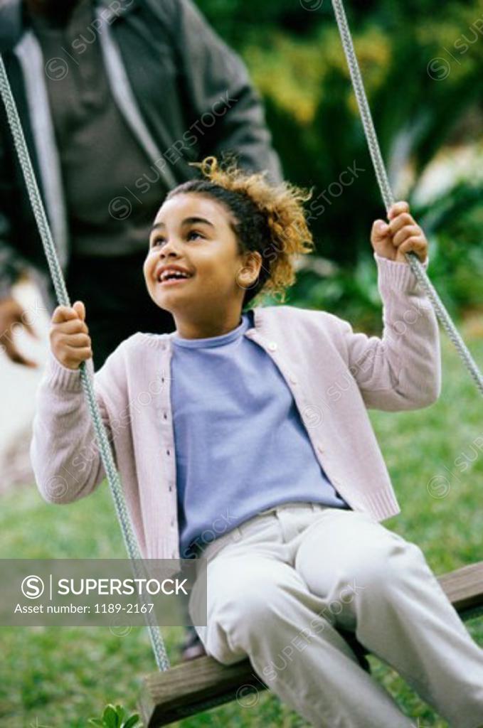Stock Photo: 1189-2167 Close-up of a girl swinging on a swing