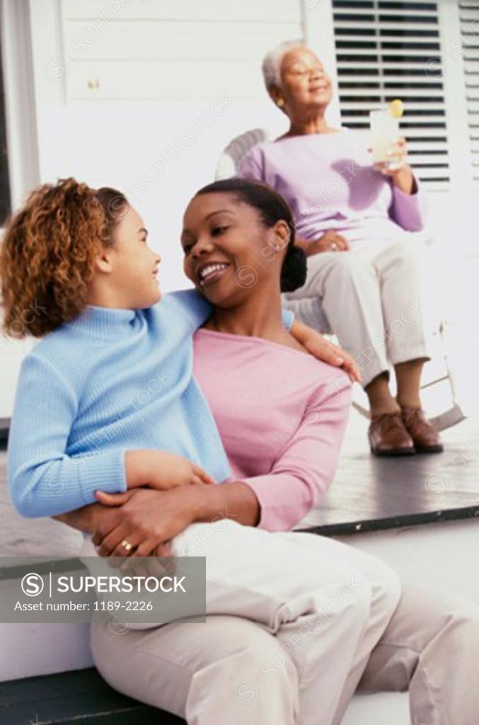 Stock Photo: 1189-2226 Close-up of a daughter sitting on her mother's lap