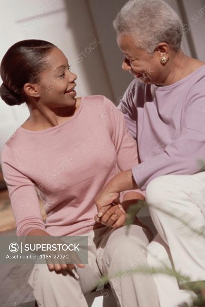 Stock Photo: 1189-2232C Mature woman looking at her daughter