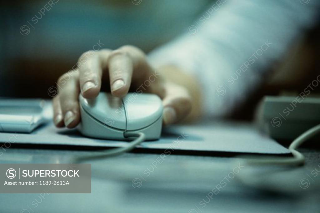Stock Photo: 1189-2613A Close-up of a person's hand holding a computer mouse