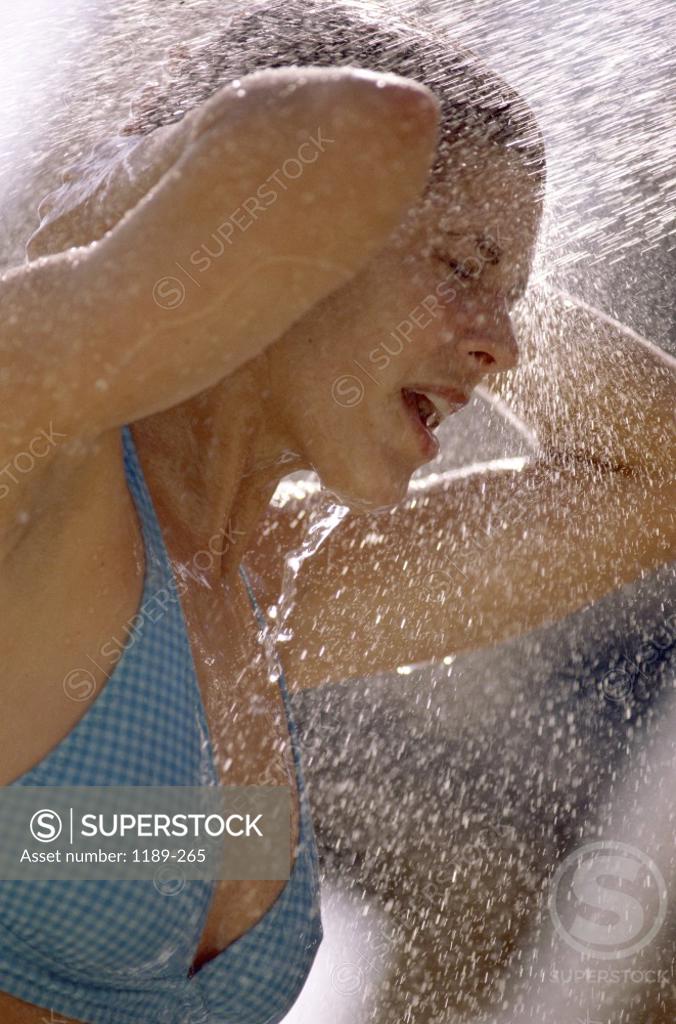 Stock Photo: 1189-265 Side profile of a young woman taking a bath