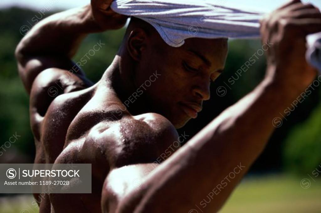 Stock Photo: 1189-2702B Close-up of a young man flexing his muscles