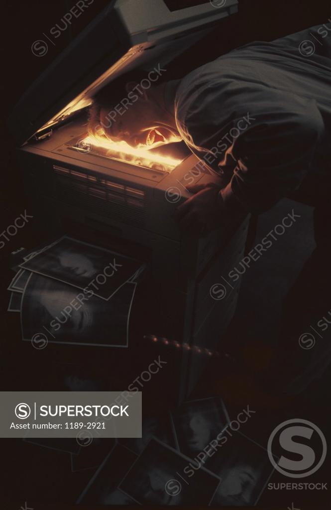 Stock Photo: 1189-2921 Businessman photocopying his face