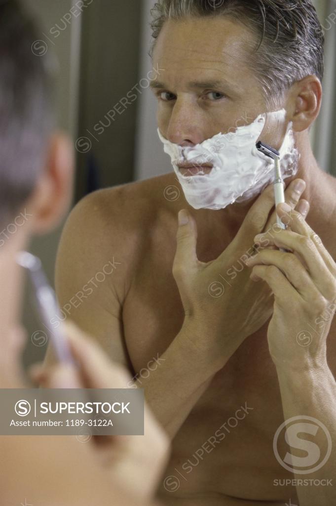 Stock Photo: 1189-3122A Mid adult man shaving