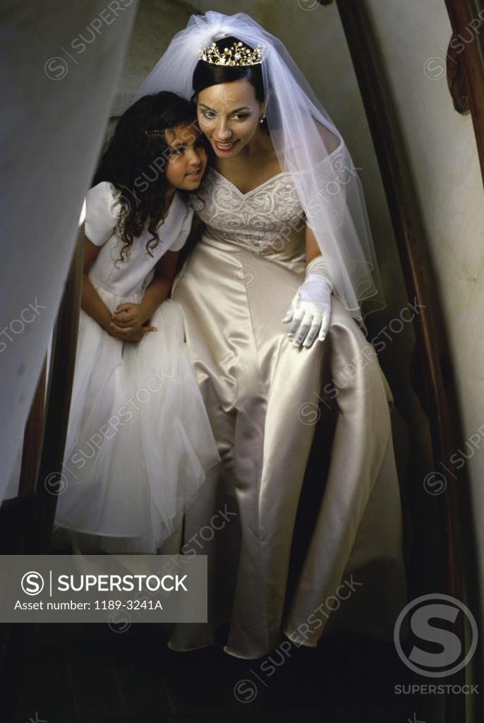 Stock Photo: 1189-3241A Bride and a bridesmaid near a staircase