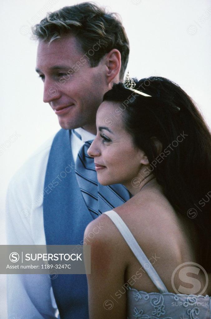 Stock Photo: 1189-3247C Close-up of a newlywed couple smirking