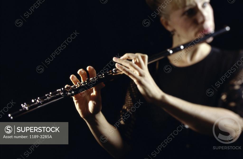 Stock Photo: 1189-3285A Young woman playing the flute