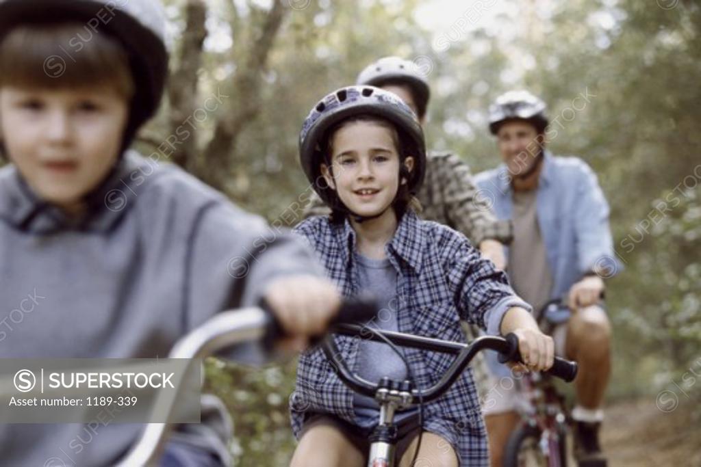 Stock Photo: 1189-339 Parents cycling with their son and daughter