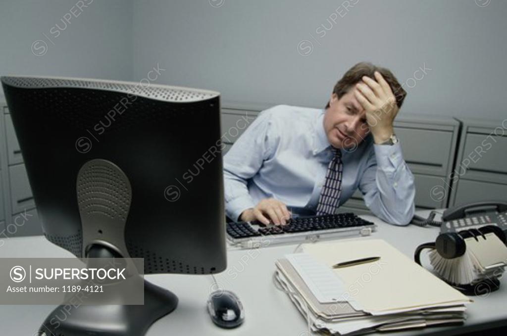 Stock Photo: 1189-4121 Businessman using a computer