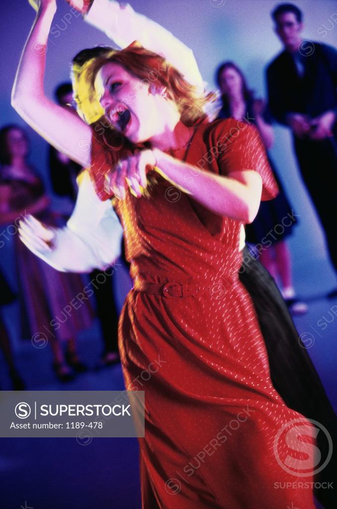 Stock Photo: 1189-478 Young couple dancing in a nightclub