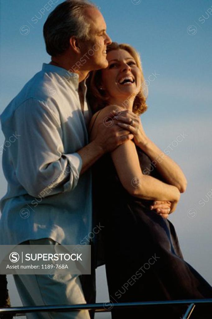 Stock Photo: 1189-768A Side profile of a senior couple embracing