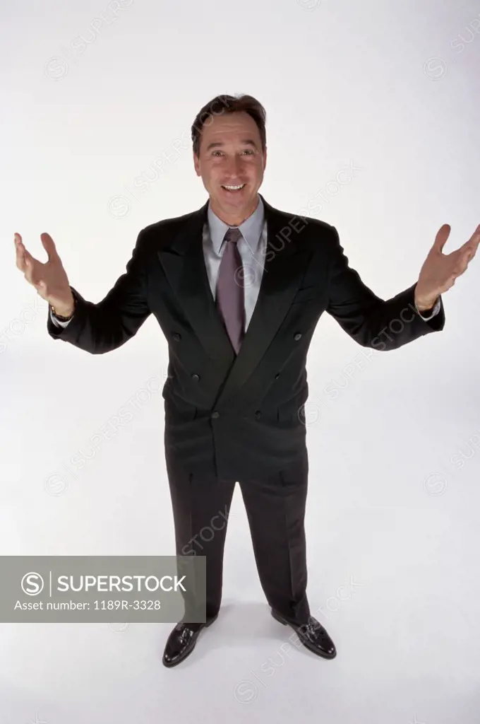 Portrait of a businessman with his arms outstretched