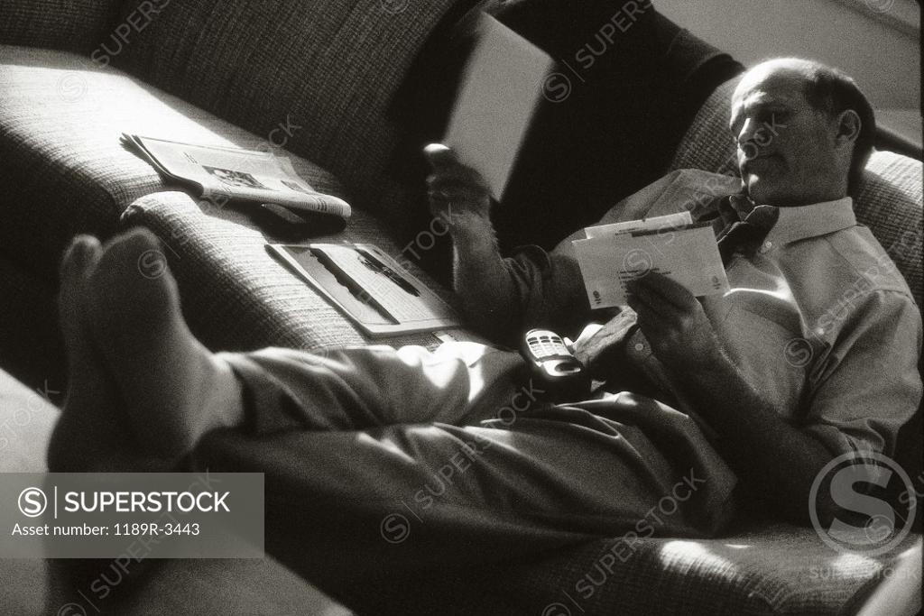 Stock Photo: 1189R-3443 Businessman reading his mail