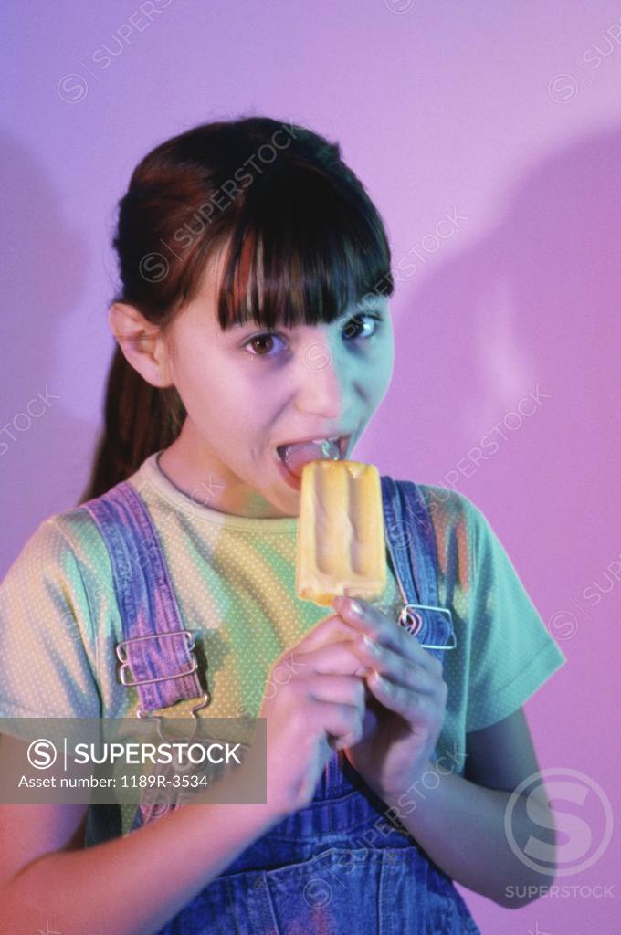 Stock Photo: 1189R-3534 Portrait of a girl eating an ice cream