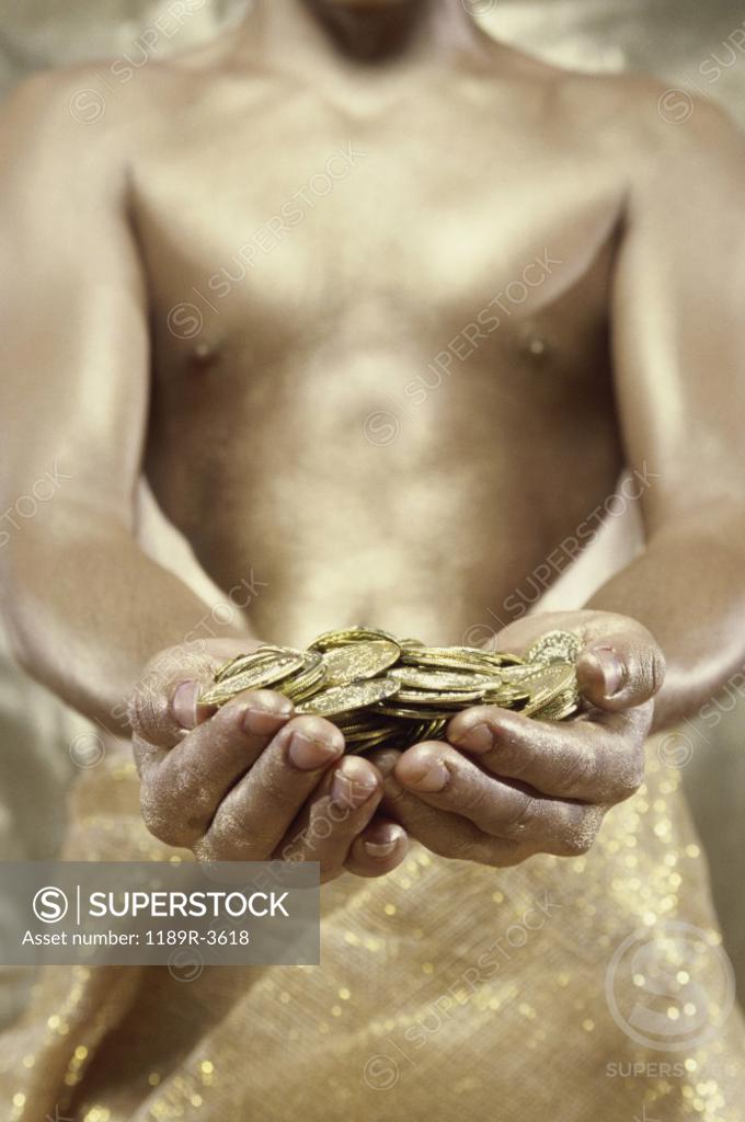 Stock Photo: 1189R-3618 Person holding gold coins