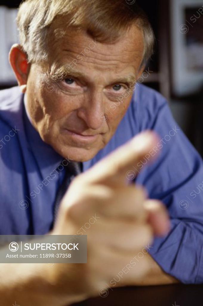 Stock Photo: 1189R-3735B Close-up of a businessman pointing forward