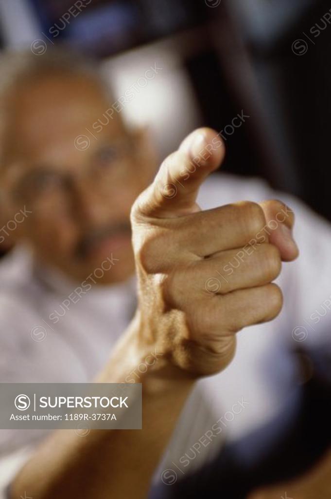 Stock Photo: 1189R-3737A Close-up of a businessman pointing forward