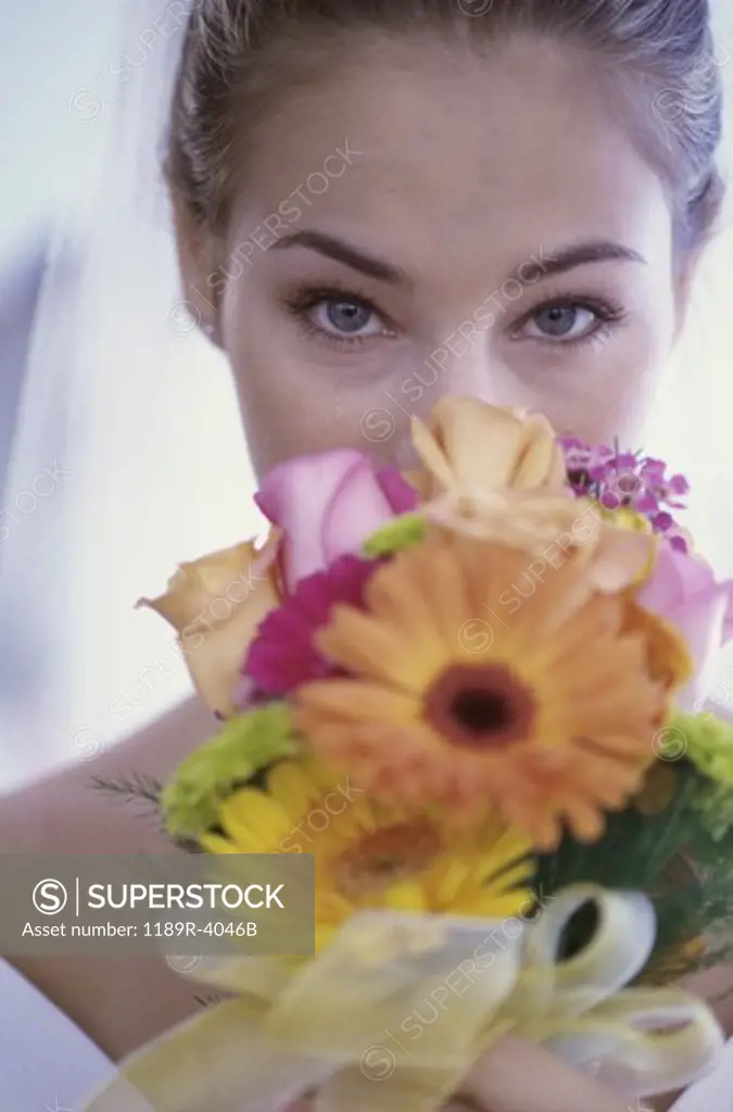 Portrait of a bride holding a bouquet of flowers