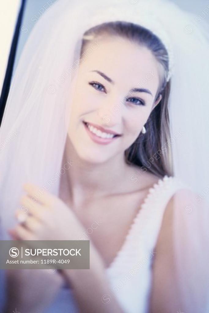 Stock Photo: 1189R-4049 Portrait of a bride smiling
